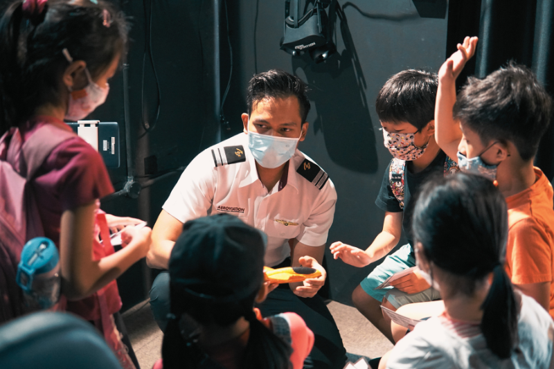 Flight Instructor Teaching Junior Aviator