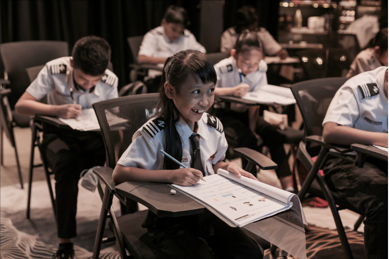 Junior Aviator Happily Listening To Class