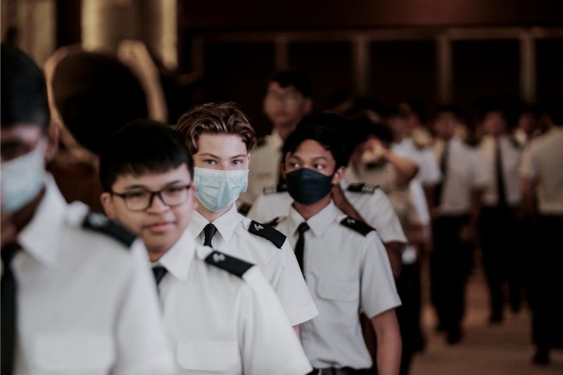 students queuing to receive recreational pilot certificate