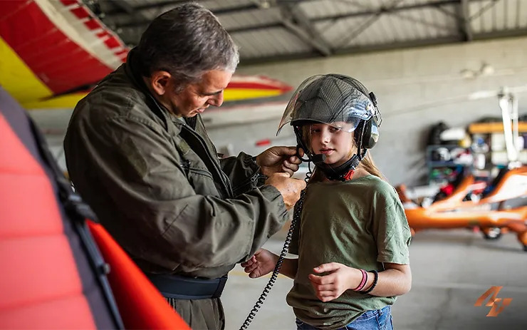instructor fastening helmet to junior