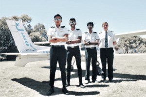 group photo of student wearing sunglasses with captain